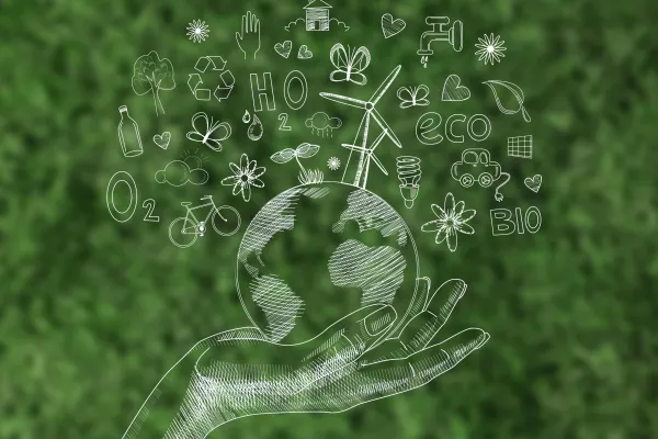 dłoń trzyma kulę ziemską, freepik